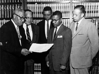 Attorney Conrad Odell Pearson (left) with attorneys, Hugh Thompson, Floyd McKissick, William G. Marsh, and John H. Wheeler. Photo courtesy of The Herald Sun. Originally from North Carolina Collection, Durham County Library.